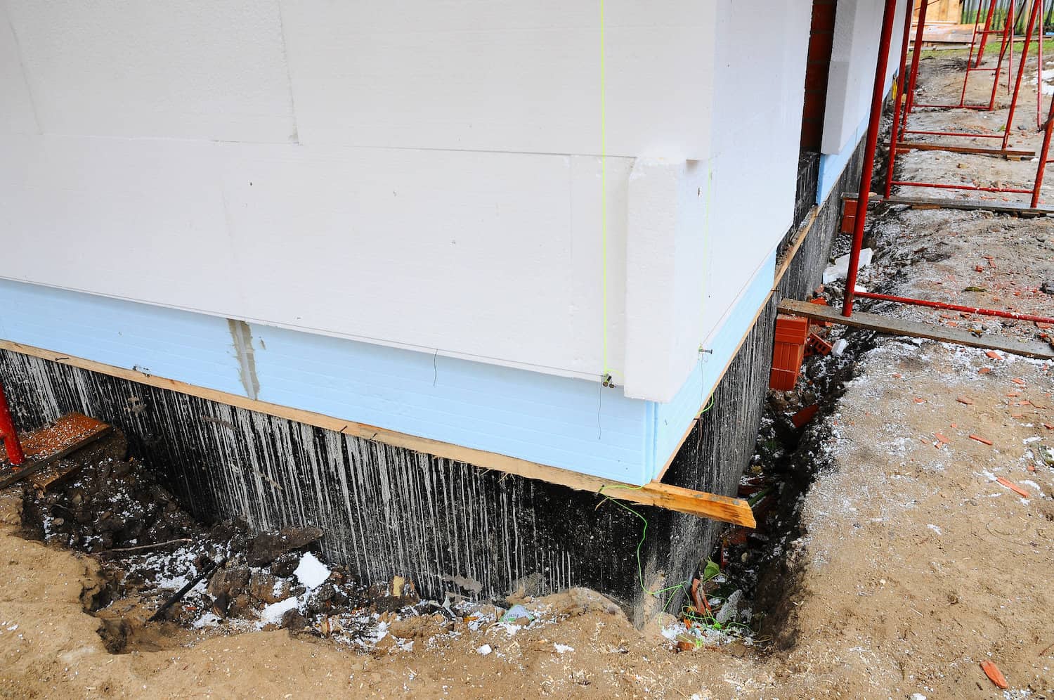 FixMy Foundation team performing professional basement waterproofing installation in Central Kentucky